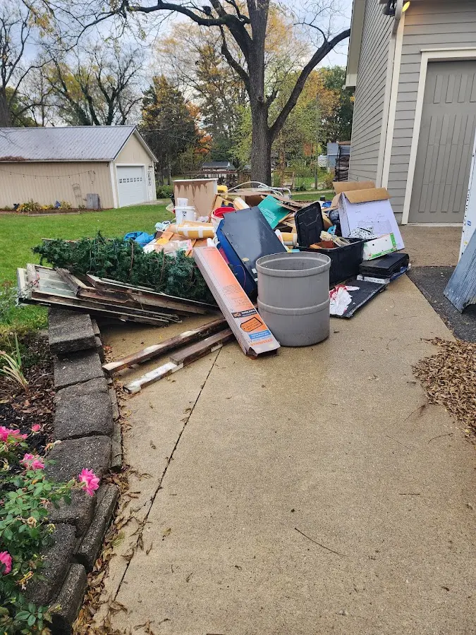 Dumpster being loaded with debris for Commercial Dumpster Rental in Jacksonville